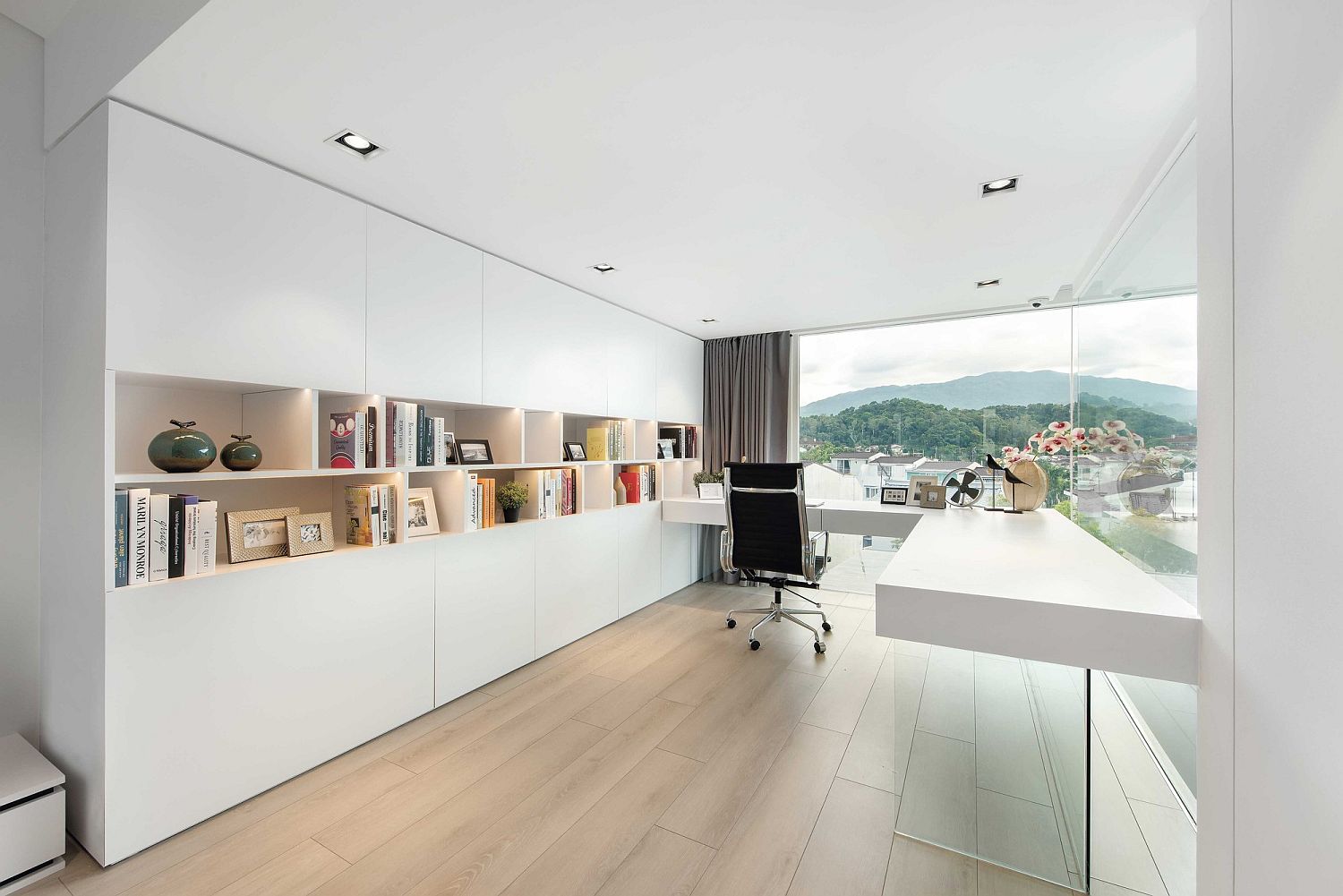 White and refined home office with ample shelving and storage space