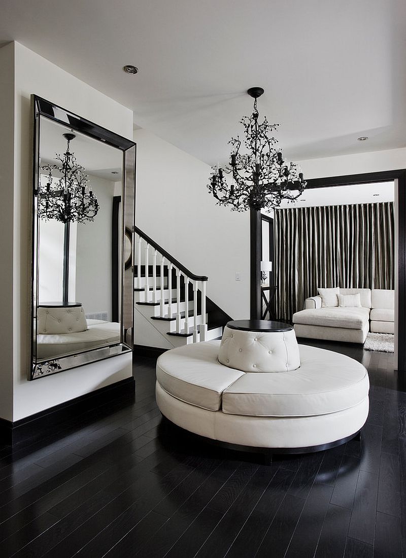 Black and white contemporary entry with a giant mirror