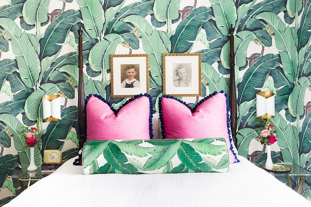 Eclectic bedroom with tropical style and leafy wallpapered backdrop