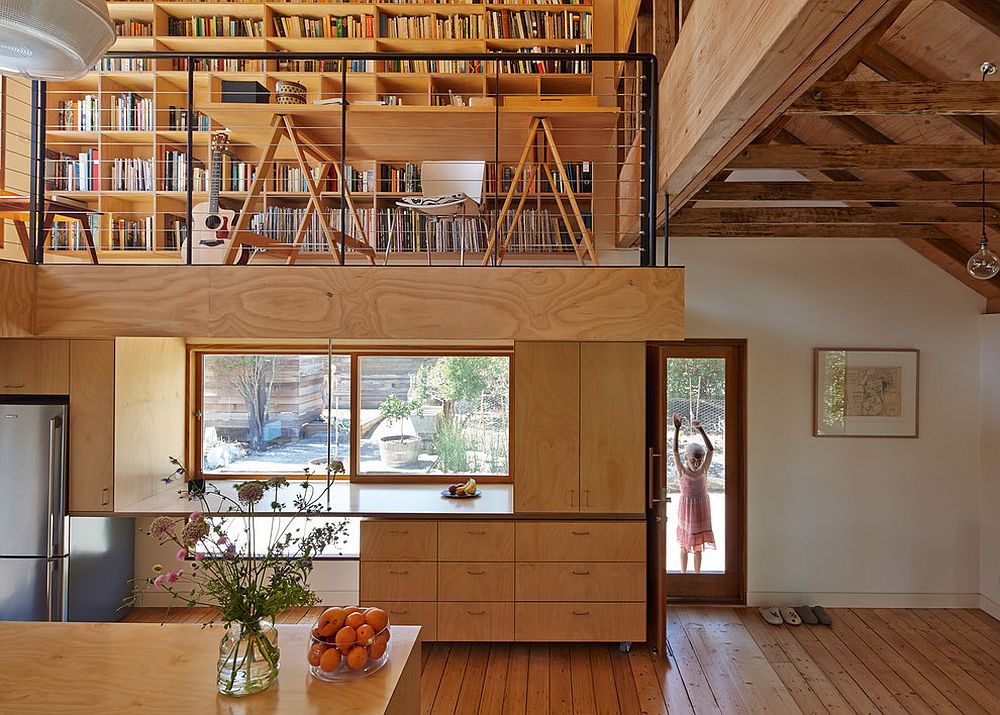 Gorgeous farmhouse kitchen in wood with mezzanine level above