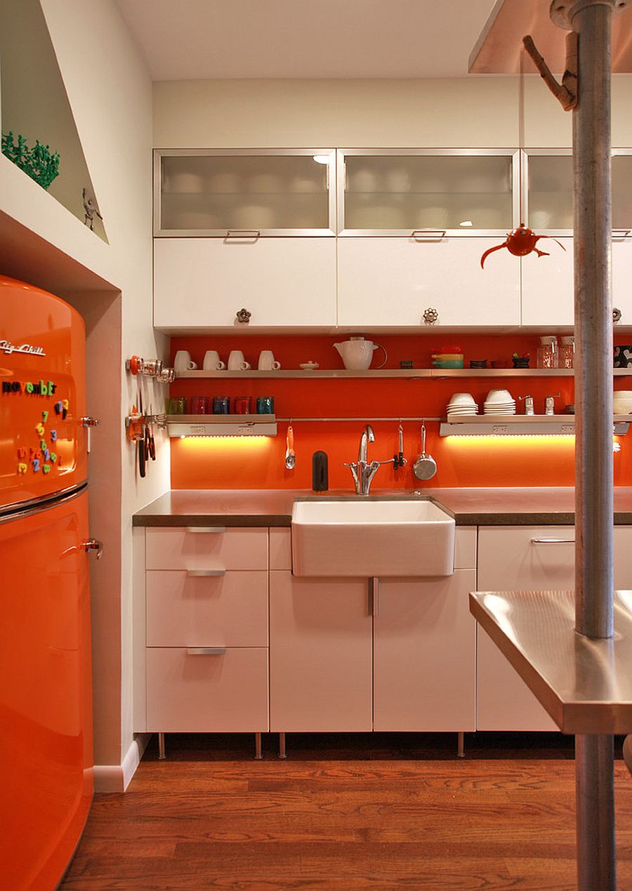 Modern industrial kitchen with brilliant splashes of orange