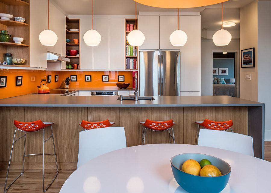 Remodeled contemporary kitchen with a bright orange backsplash