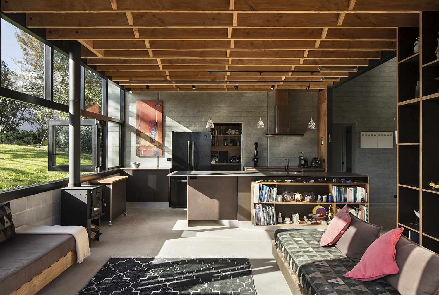 Sitting area and kitchen of the Modern Bay House with a stylish mezzanine level above