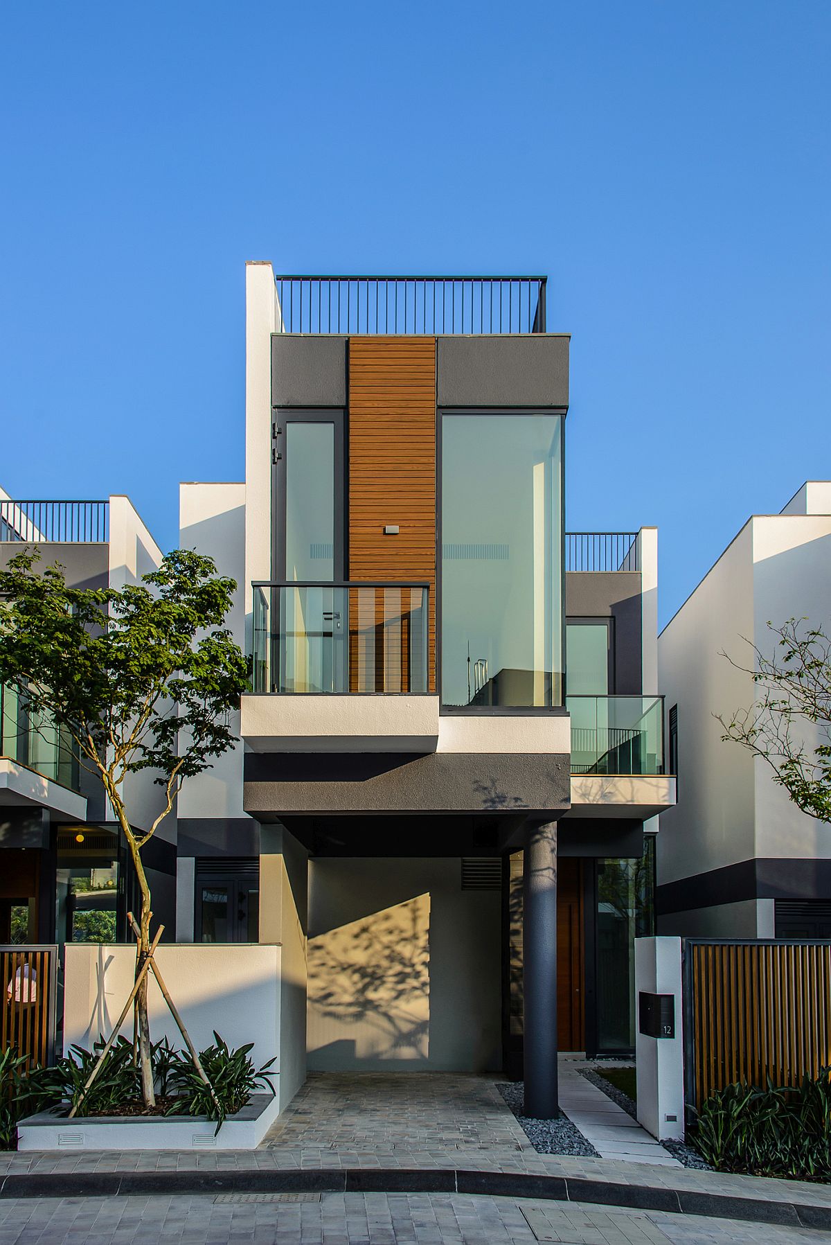 Street facade of Whitesands Home with a view of South China Sea