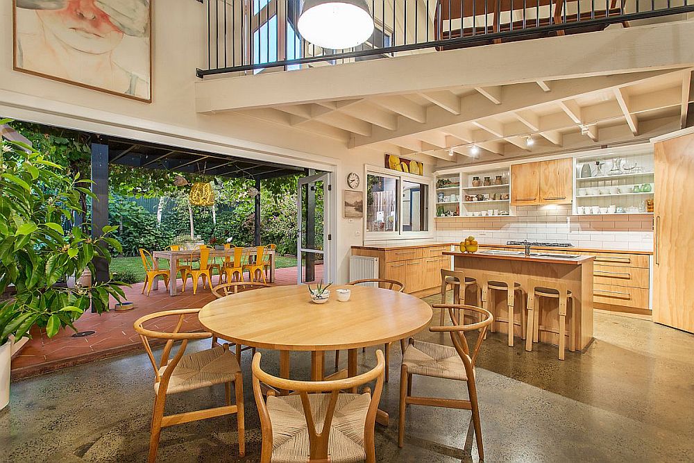 Warehouse turned into home with a high roof allows for the design of a kitchen under the mezzanine