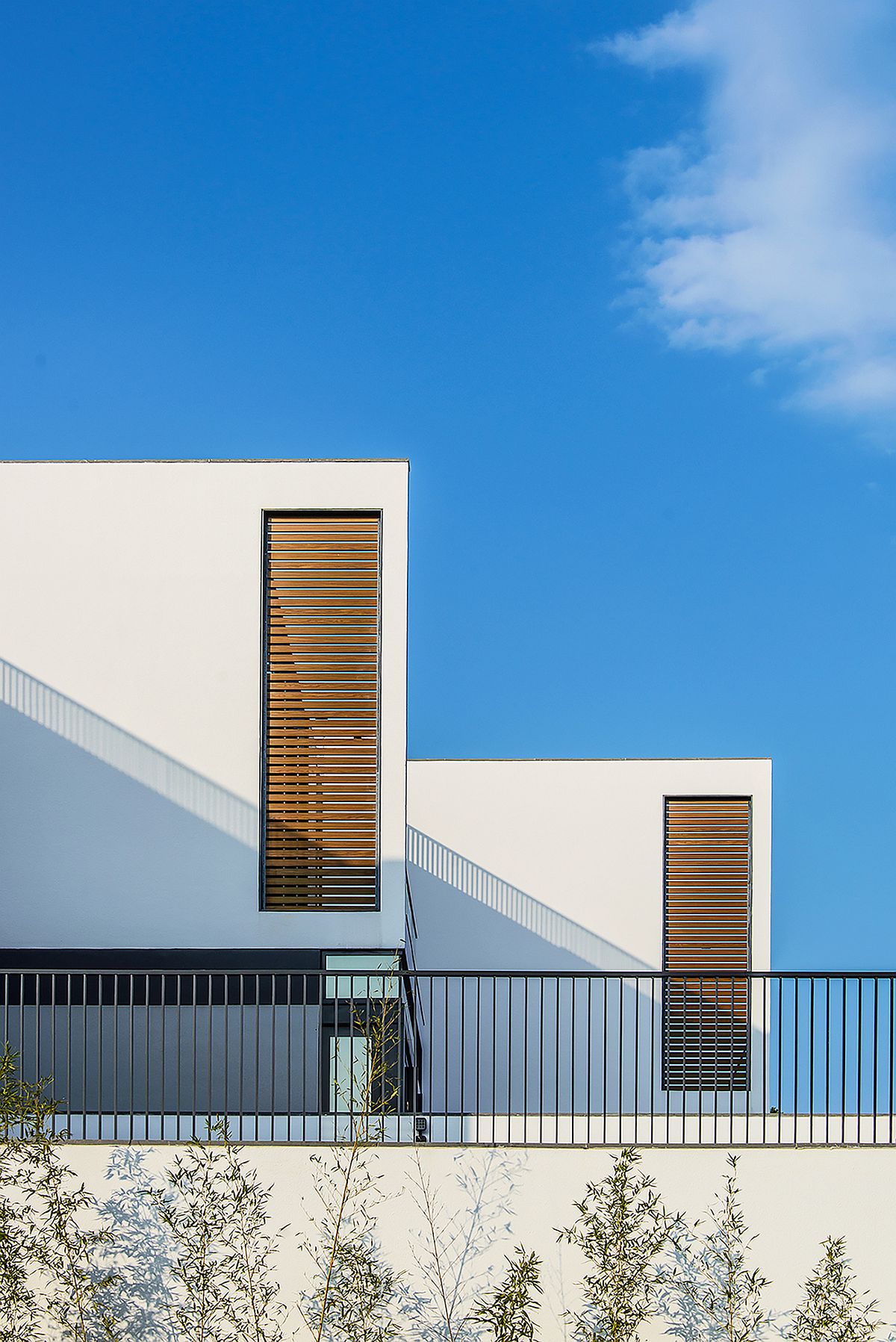 Wooden slats offer privacy along with bringing in natural light