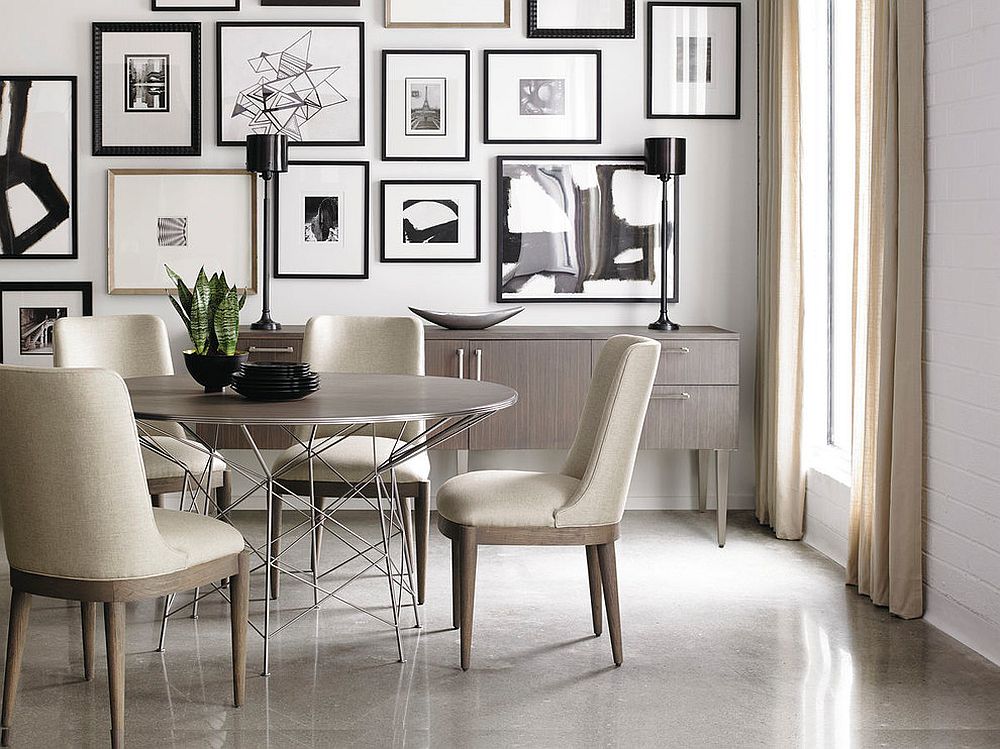 Exquisite dining room in black and white with cool gallery wall that uses black and white art