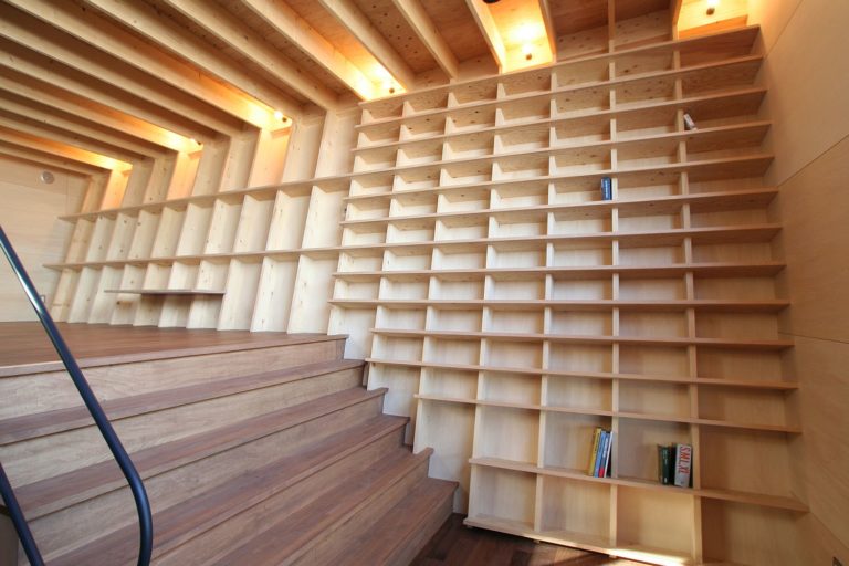 Oblique Walls Create a Cool Double Height Bookshelf in this Japanese
