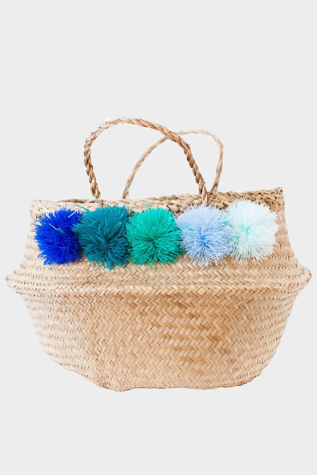 Seagrass-basket-with-blue-and-teal-pom-poms