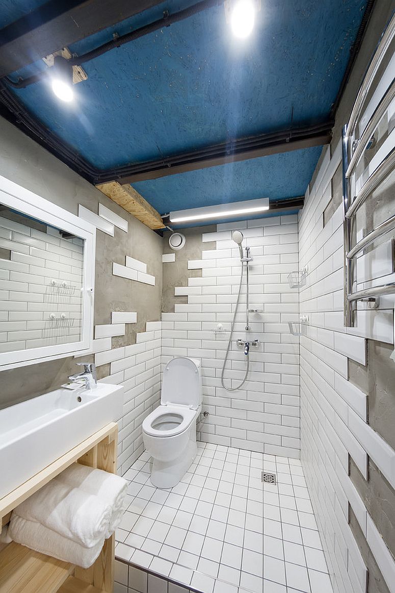 Exquisite industrial bathroom in white with blue ceiling