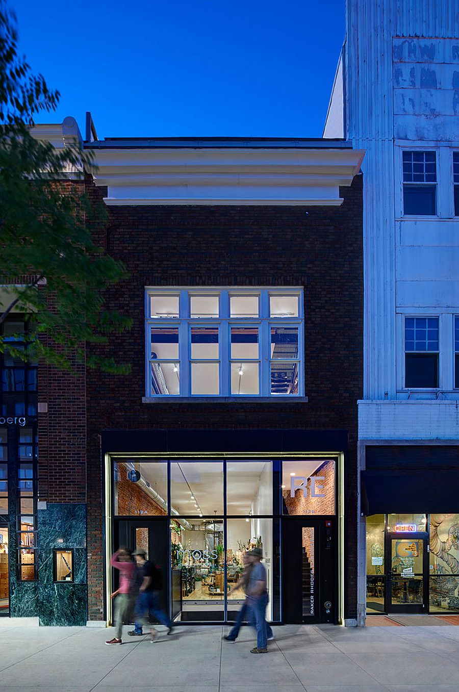 Glazed-black-anodized-aluminum-storefront-blends-in-with-the-classic-vibe-of-the-building
