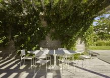 Lovely-outdoor-dining-area-with-greenery-above-offering-ample-shade-217x155