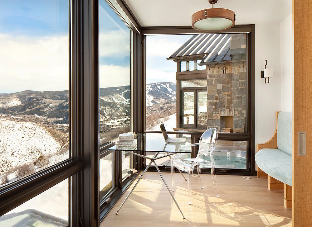 Minimal-contemporary-home-office-with-transparent-chair-slim-table-and-mountain-views