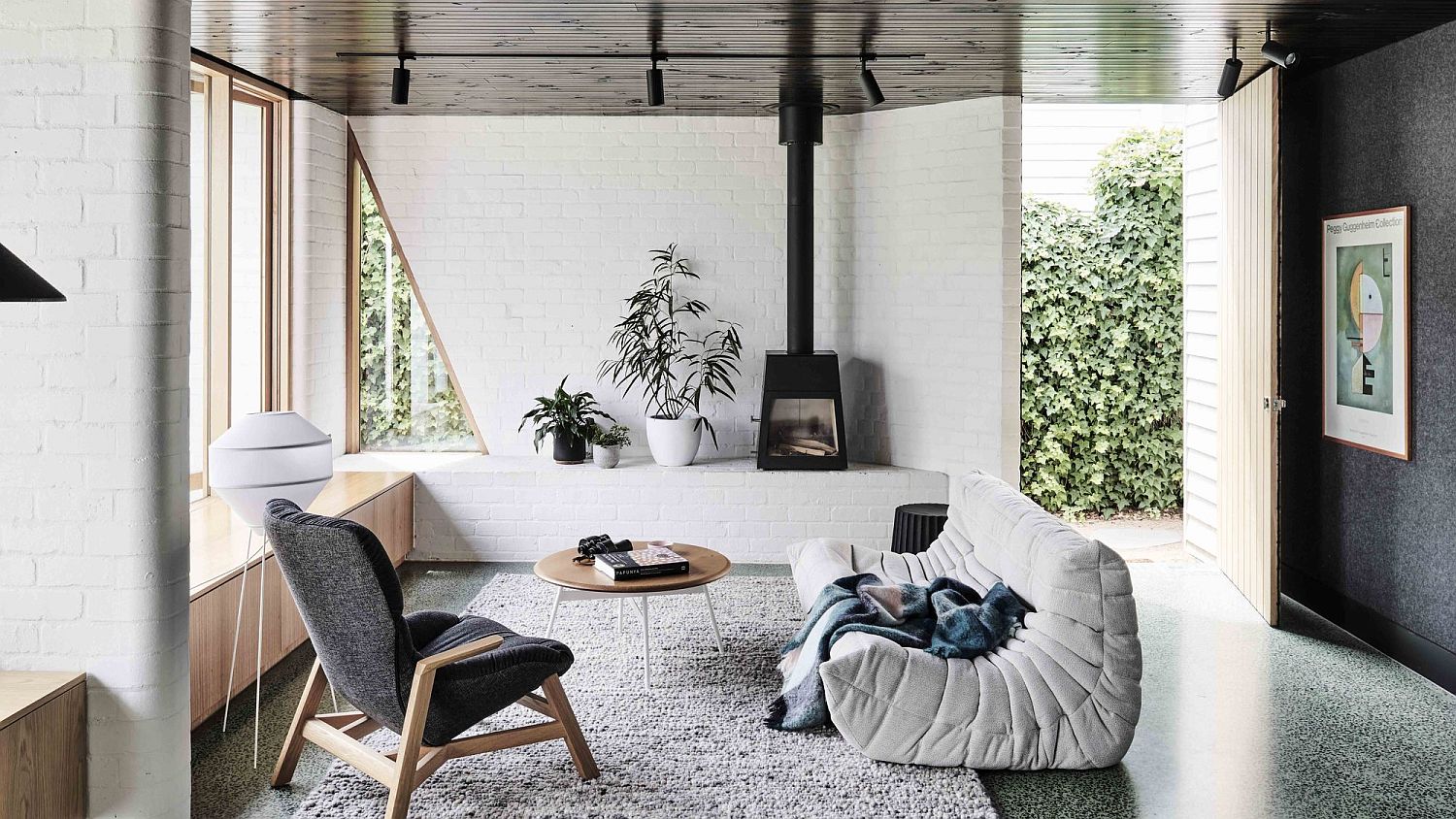 New-living-room-of-the-house-with-brick-walls-and-comfy-nooks