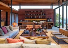 Open-interior-of-the-Brazilian-home-with-glass-and-pigmented-concrete-walls-217x155
