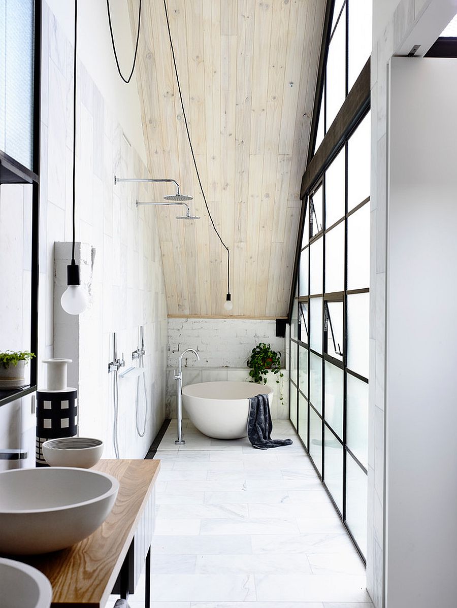 Space-savvy industrial bathroom with plenty of natural lighting