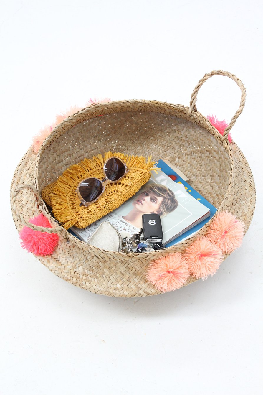 Storage-basket-with-bright-pom-poms