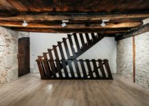 Weathered-walls-ceiling-beams-and-metal-staircase-usher-in-plenty-of-textural-contrast-217x155