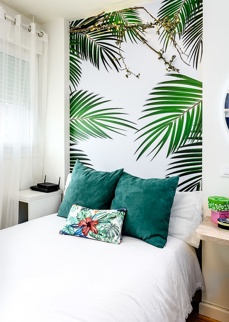 All-white bedroom with a tropical wallpaper headboard