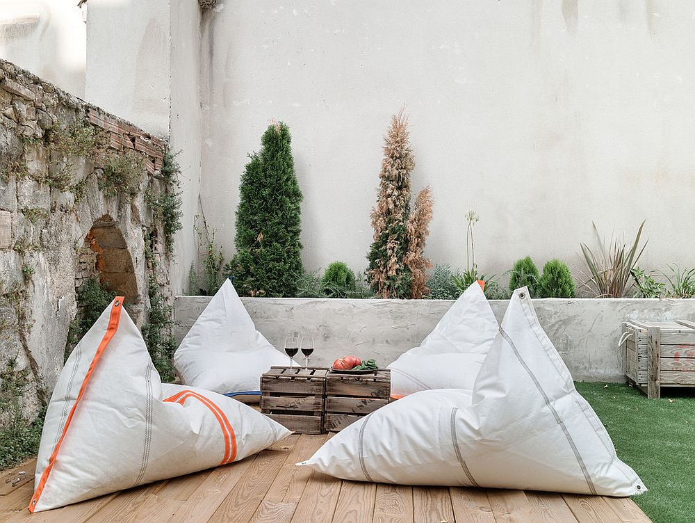 Bean bags and wooden crates turn the outdoor deck into a cozy hangout