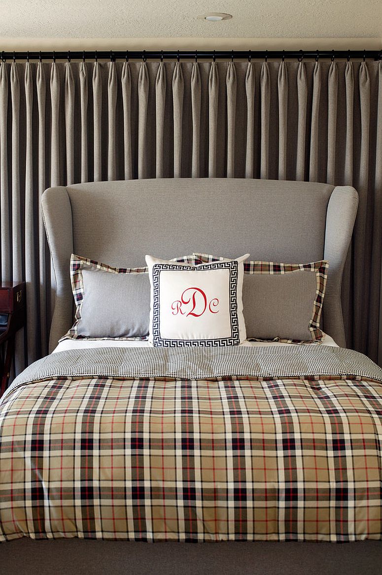 Bedding in plaid brings pattern without altering the style of the contemporary living room