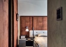Concrete-walls-and-wooden-walls-sit-comfortably-next-to-one-another-in-the-bedroom-217x155