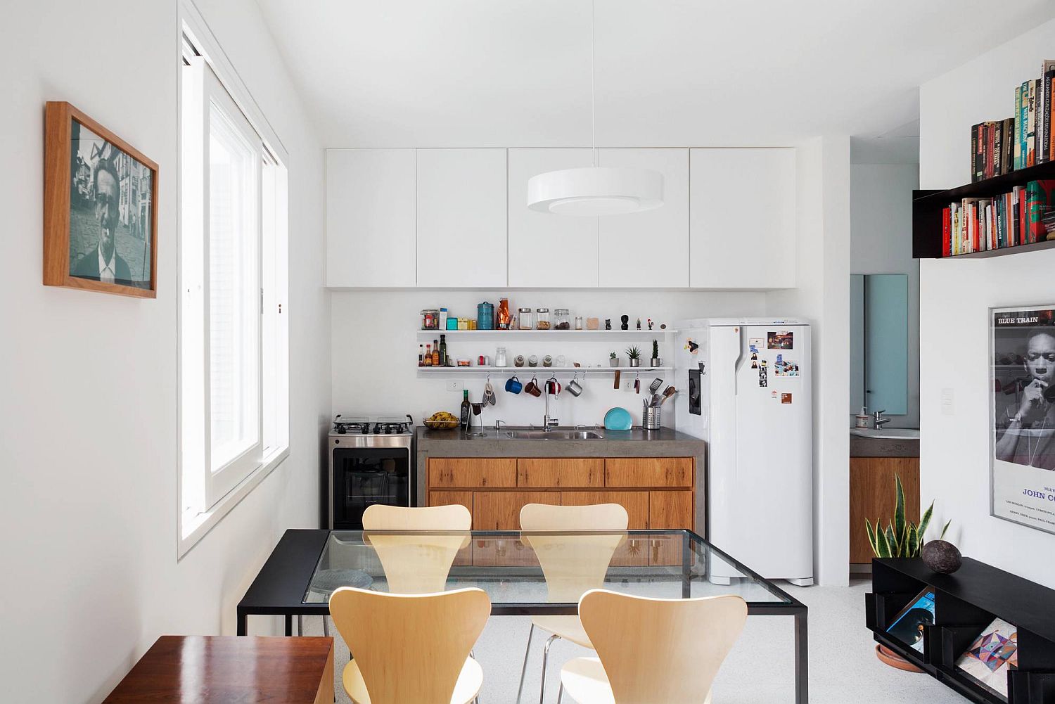 Fabulous modern kitchen at the end of the open plan living inside the Brazilian apartment