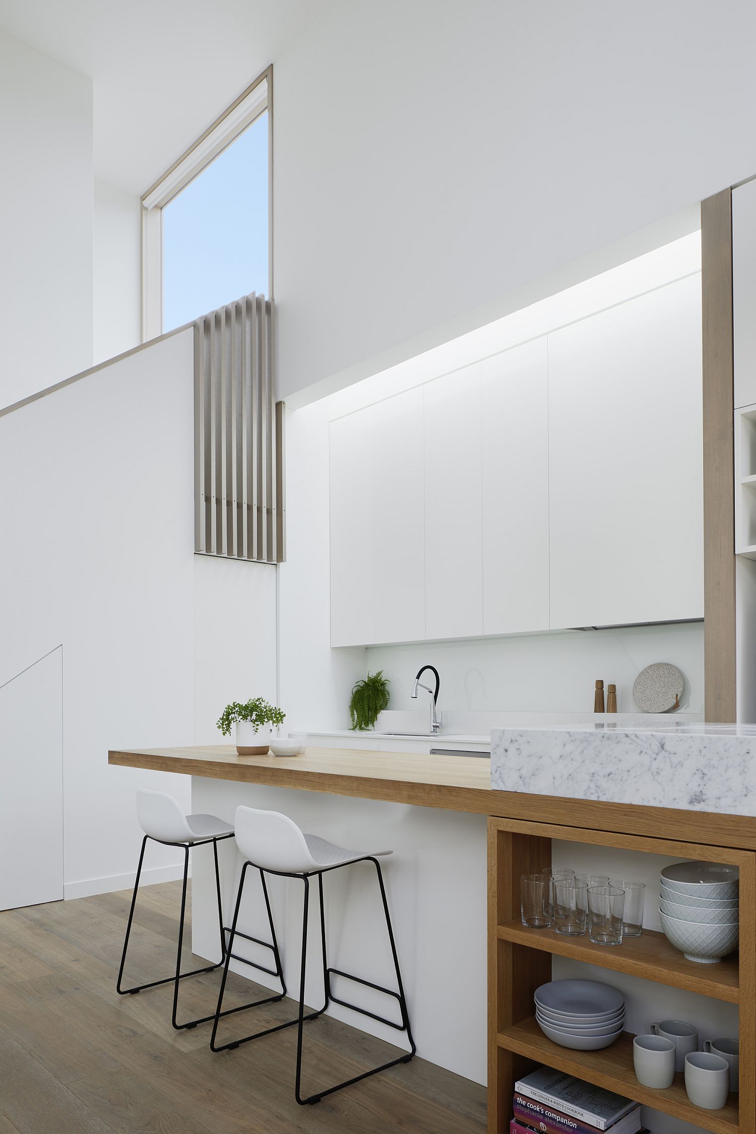 Polished modern kitchen in white and wood