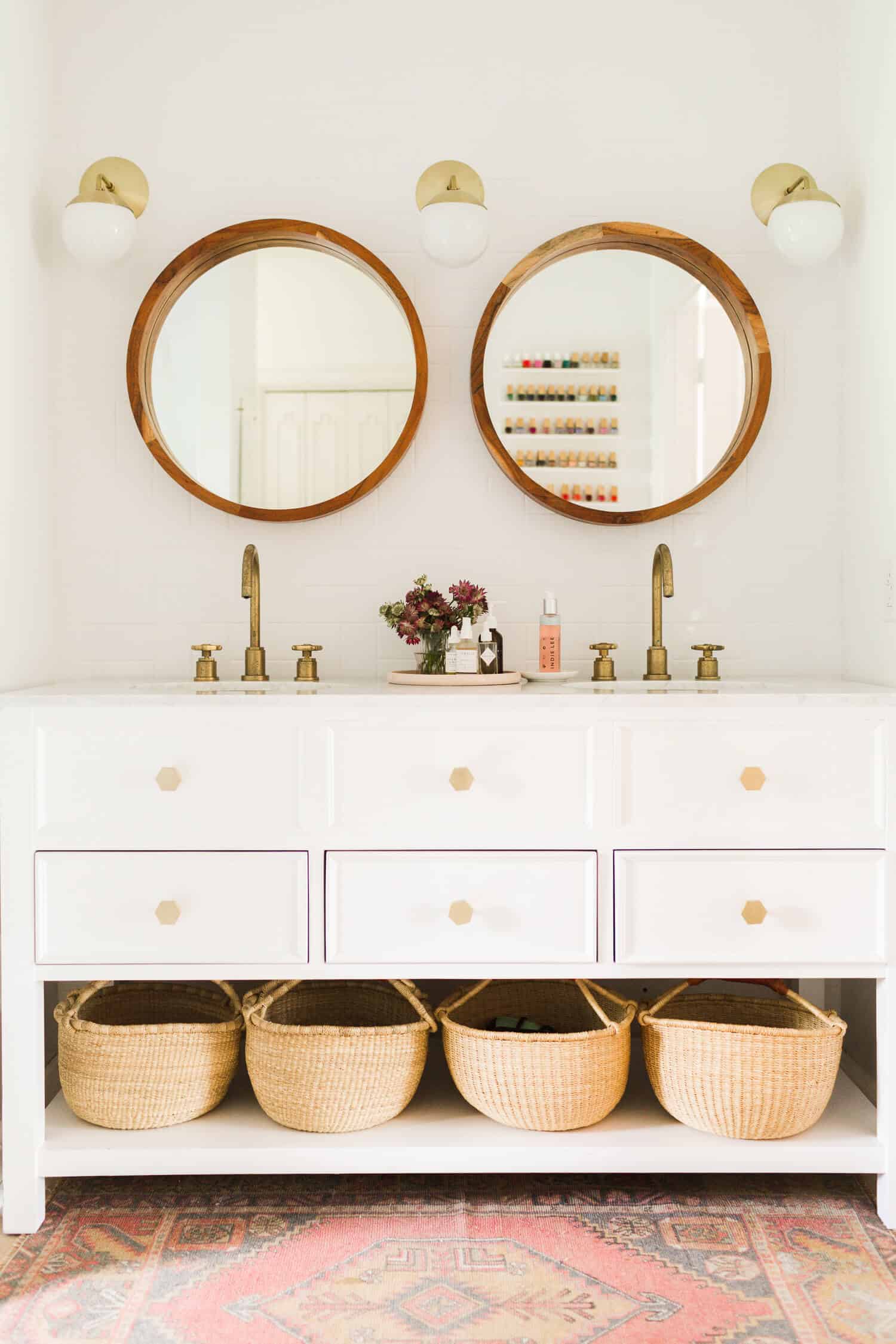 Row of storage baskets in a remodeled bathroom