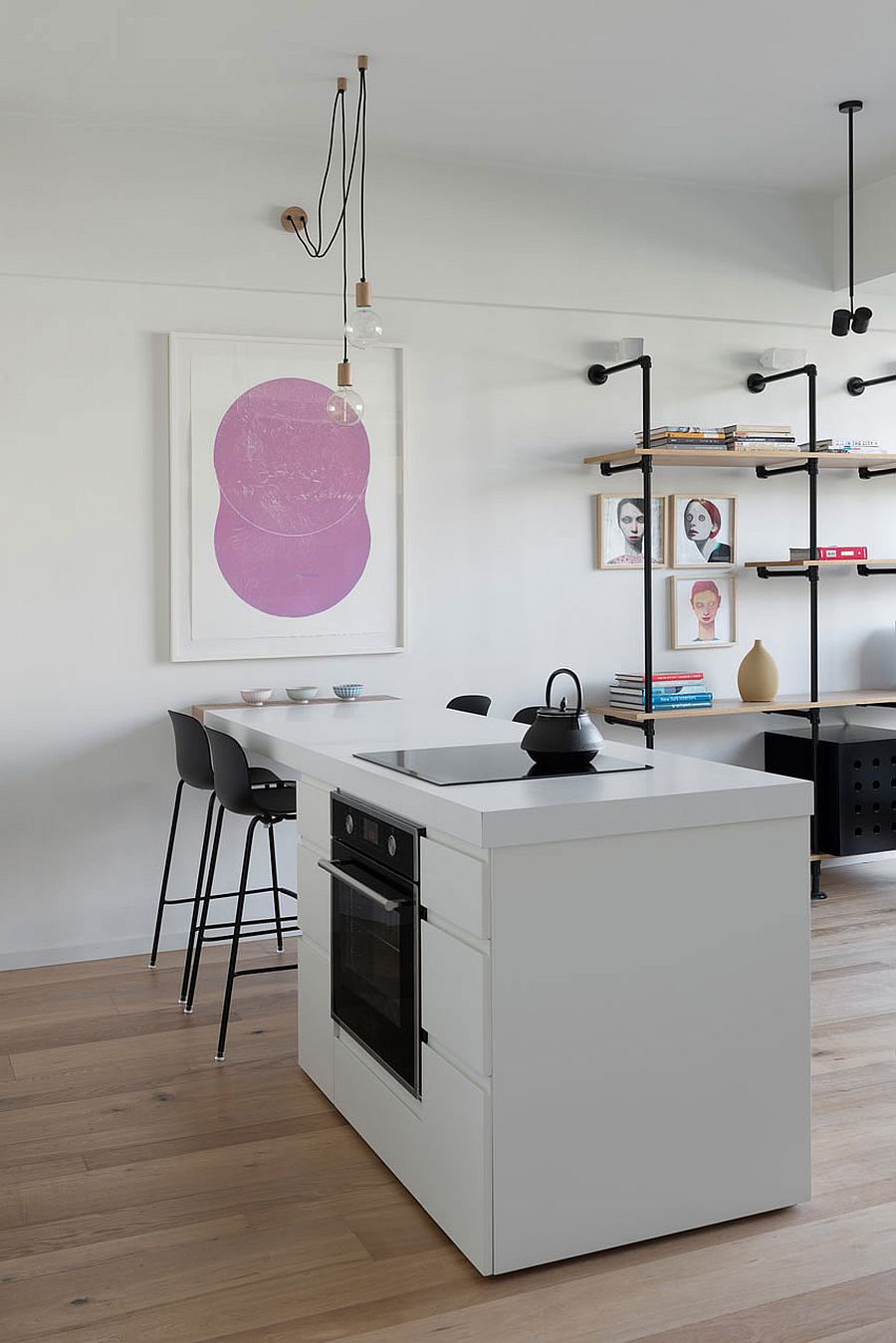 Small kitchen of the open plan living area in white