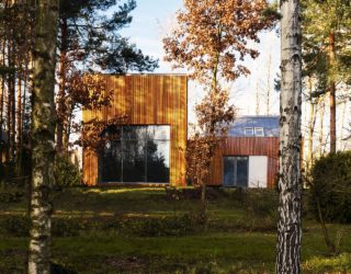 Serene Forest Retreat Draped in Wood with Ingenious Functional Form