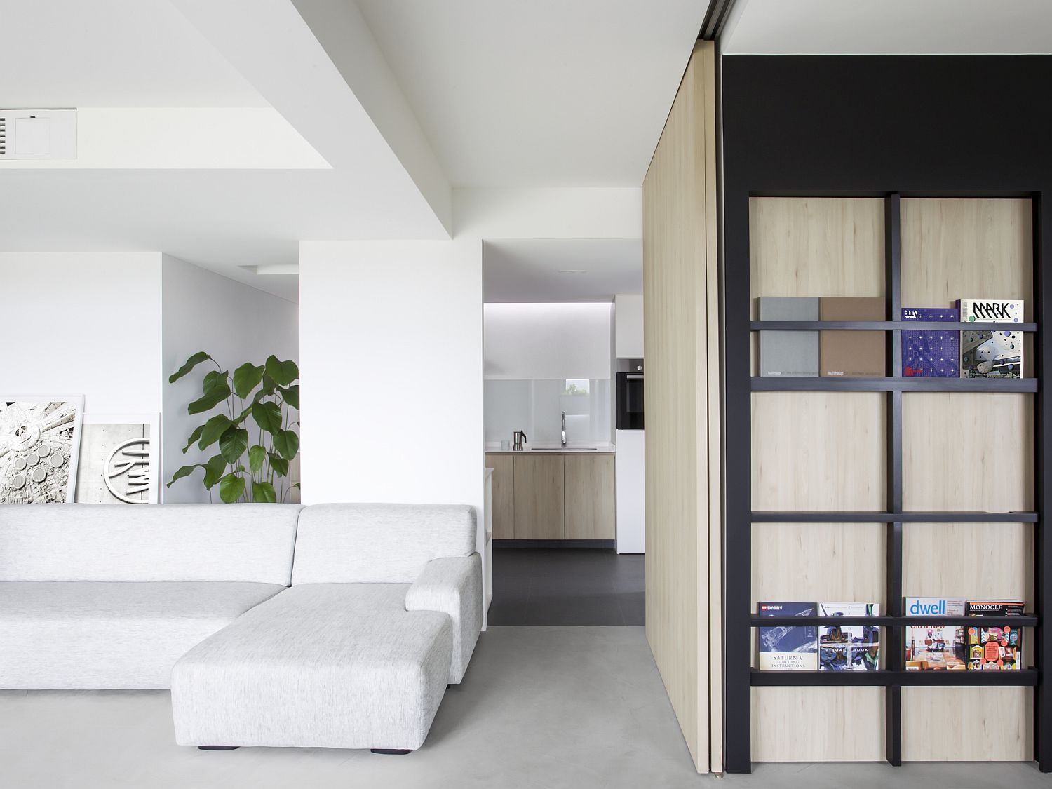 Smart wooden partitions create rooms within a larger room