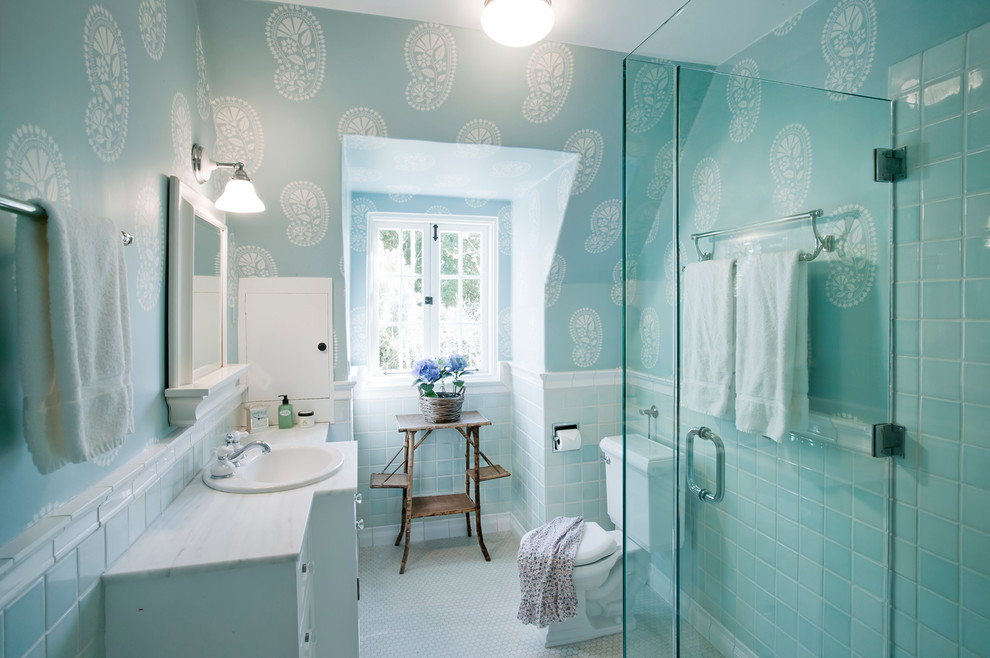 Stylish contemporary bathroom in blue with curated use of paisley pattern