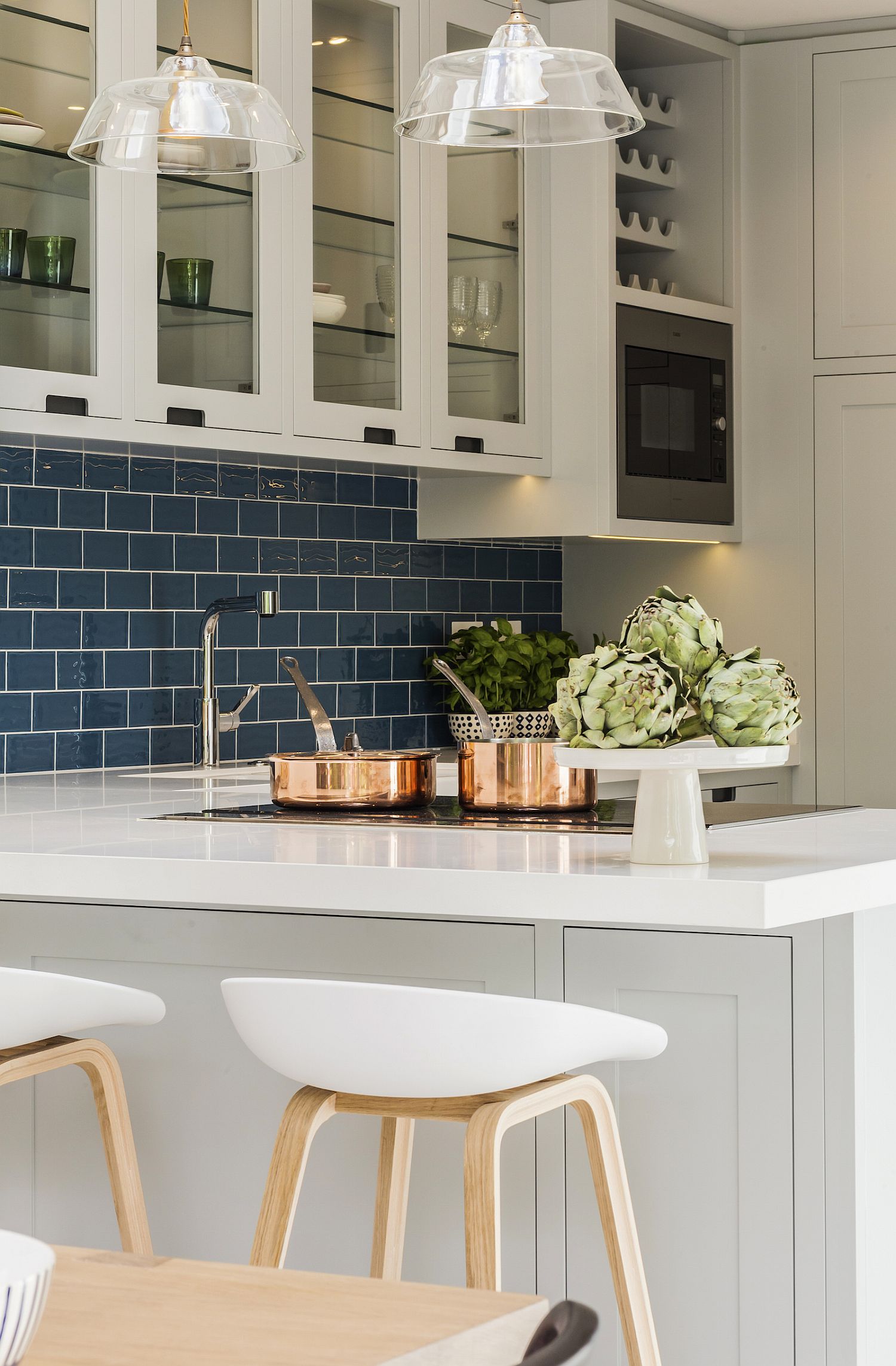 Stylish contemporary kitchen with blue tiled backsplash