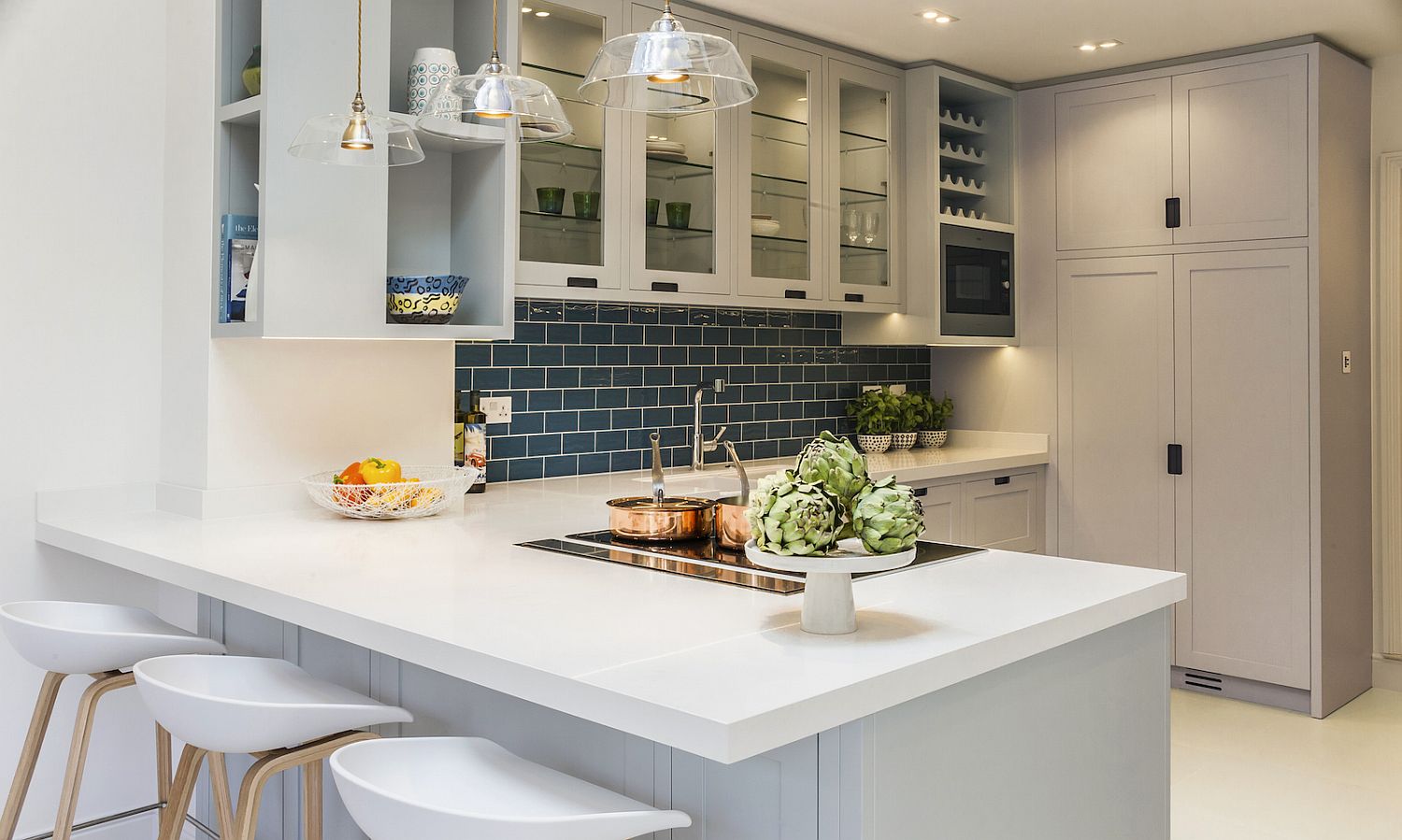 Subway Tile Backsplash adds color to the kitchen in white