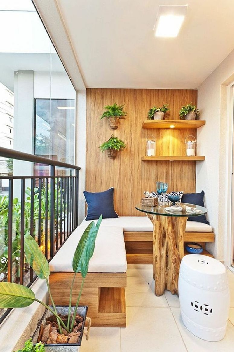 Tiny-balcony-with-plush-seating-storage-options-and-floating-shelves