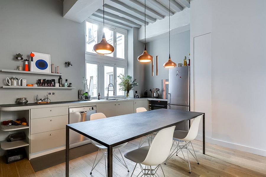 Tiny corner L-shaped kitchen inside the chic Paris apartment