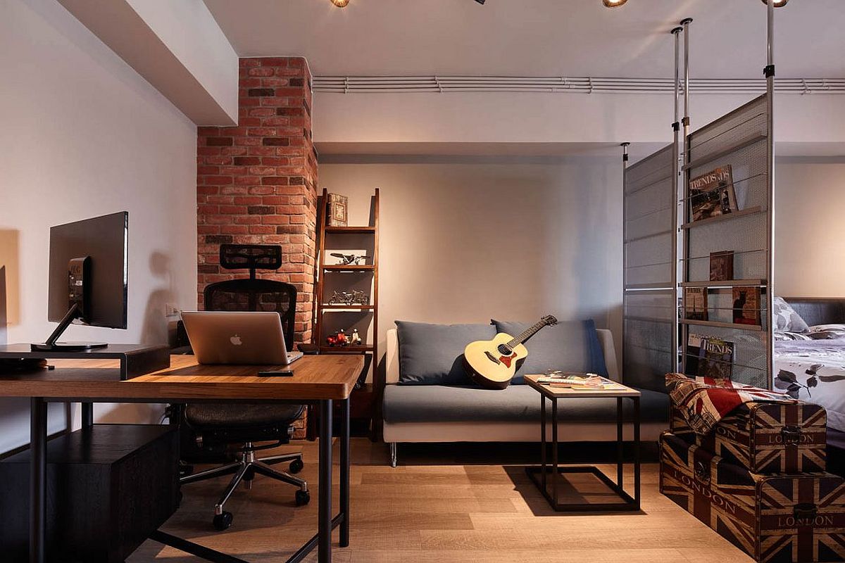 Tiny industrial loft style living room with brick wall section and ergonomic decor