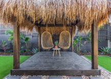 Tropical-escape-inspired-outdoor-deck-with-hanging-seats-217x155