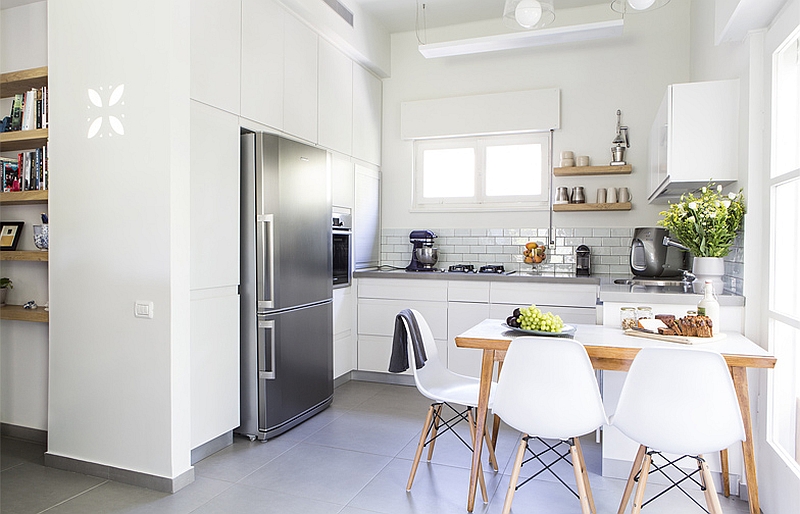 White tiny kitchen in the corner with subway tile backsplash