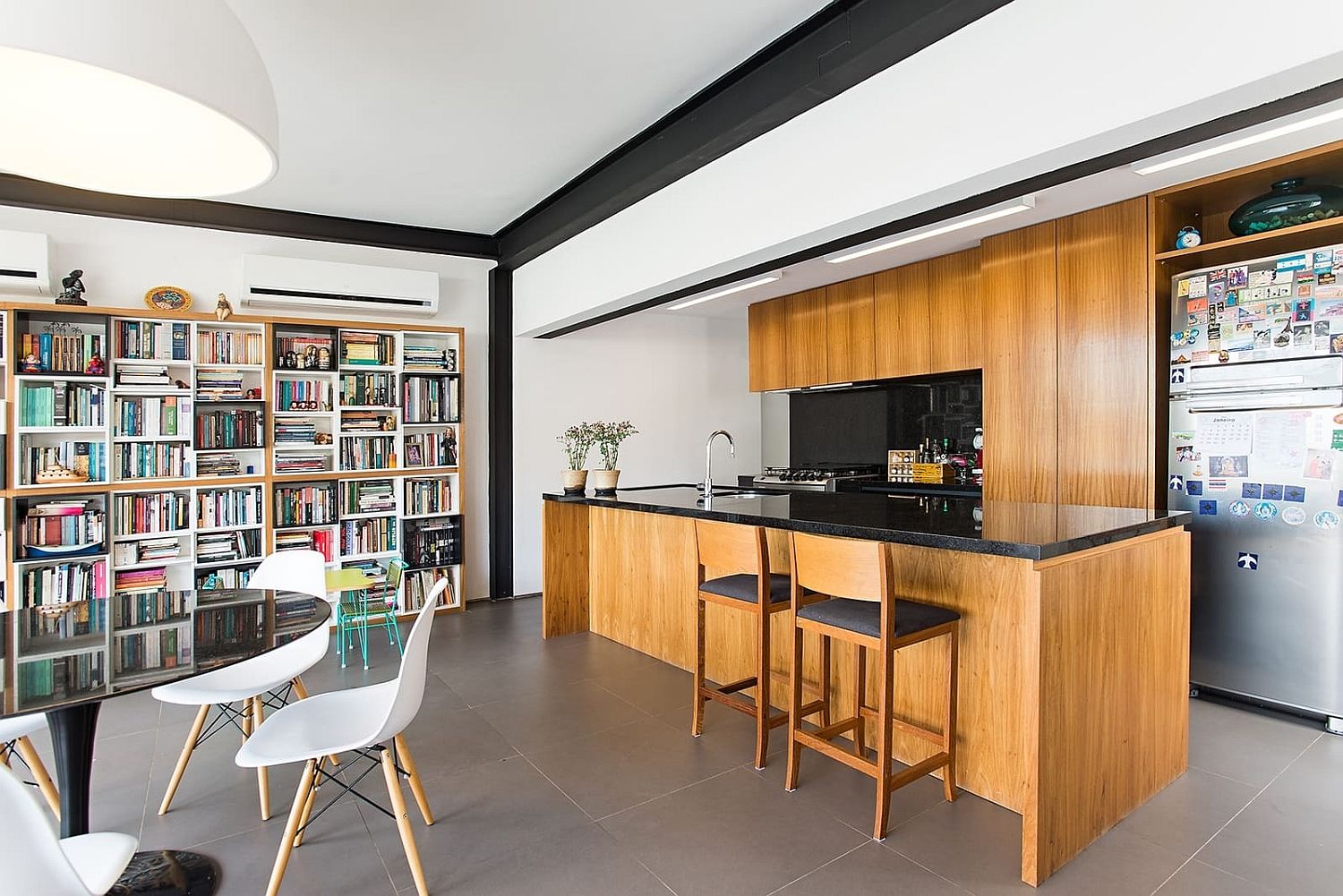 Wooden kitchen island adds different textural element to the open plan living