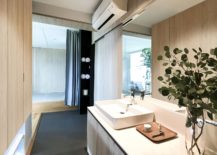 Wooden-master-bathroom-walls-create-a-warm-and-well-lit-setting-217x155