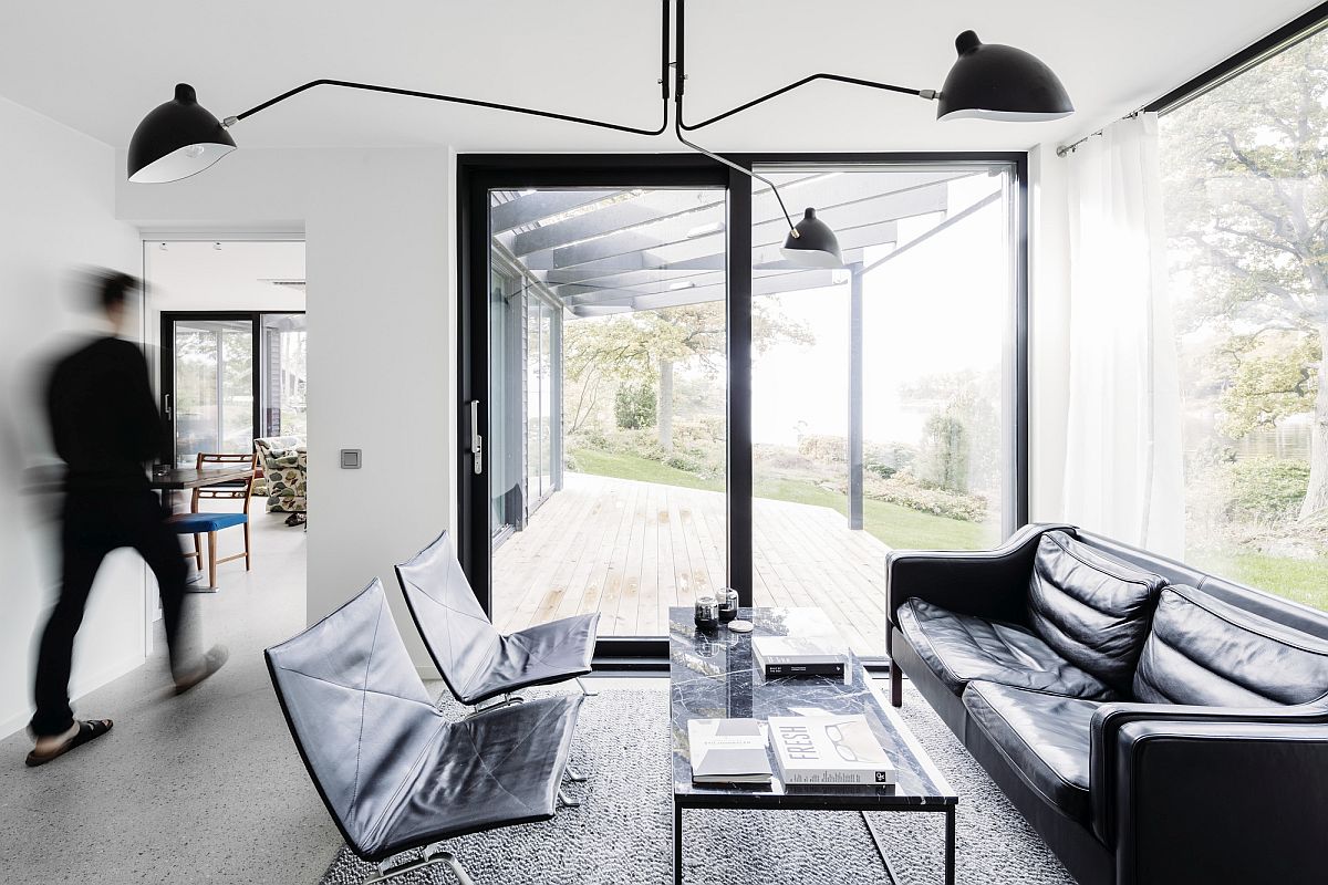 Black and white living room of the villa in Swedish oak forest