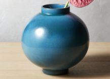 Blue-teal-vase-with-tropical-foliage-217x155