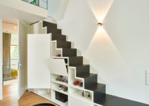 Contemporary-stairway-in-black-and-white-with-shelving-and-cabinets-217x155