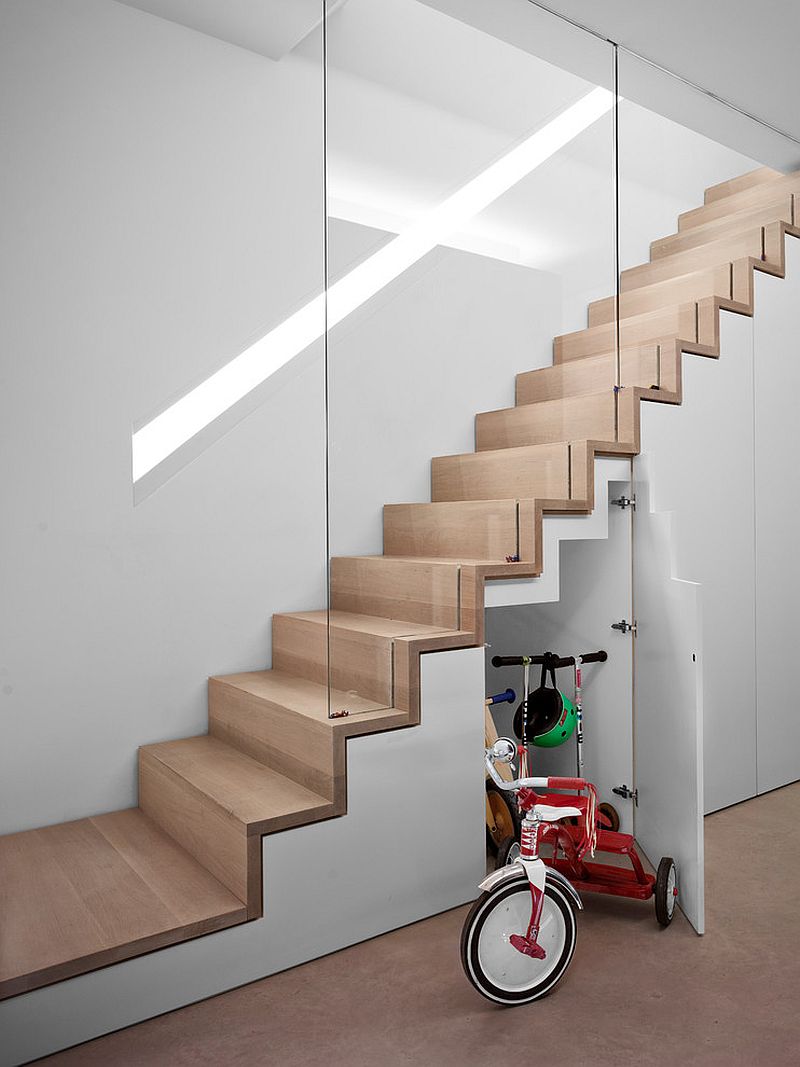 Light-filled contemporary stairway with smart storage area underneath