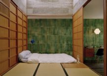 Minimal-Asian-style-bedroom-with-green-walls-and-a-woodsy-platform-bed-217x155