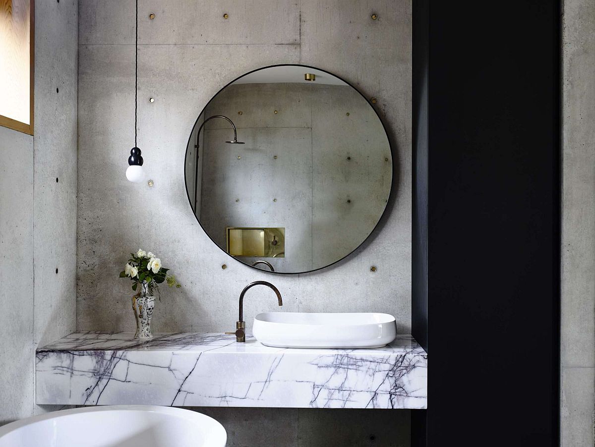 Modern-bathroom-with-concrete-walls-and-a-dashing-marble-vanity