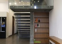 Raw-concrete-staircase-with-glass-railing-217x155