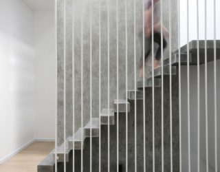 Raw Concrete Staircase Steals the Show Inside this Narrow Home!